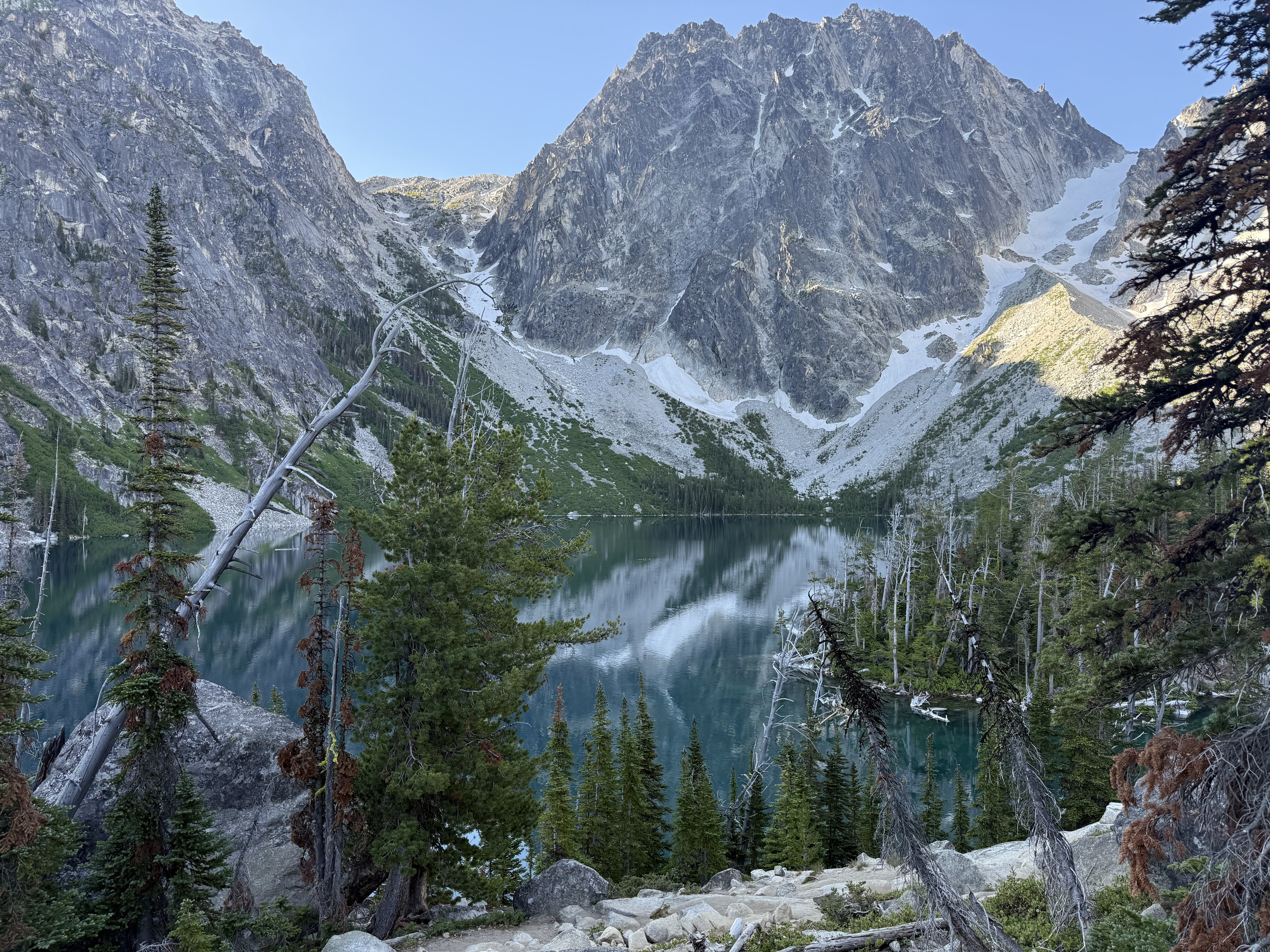 Colchuck Lake reflecting dramatic granite peaks and sky