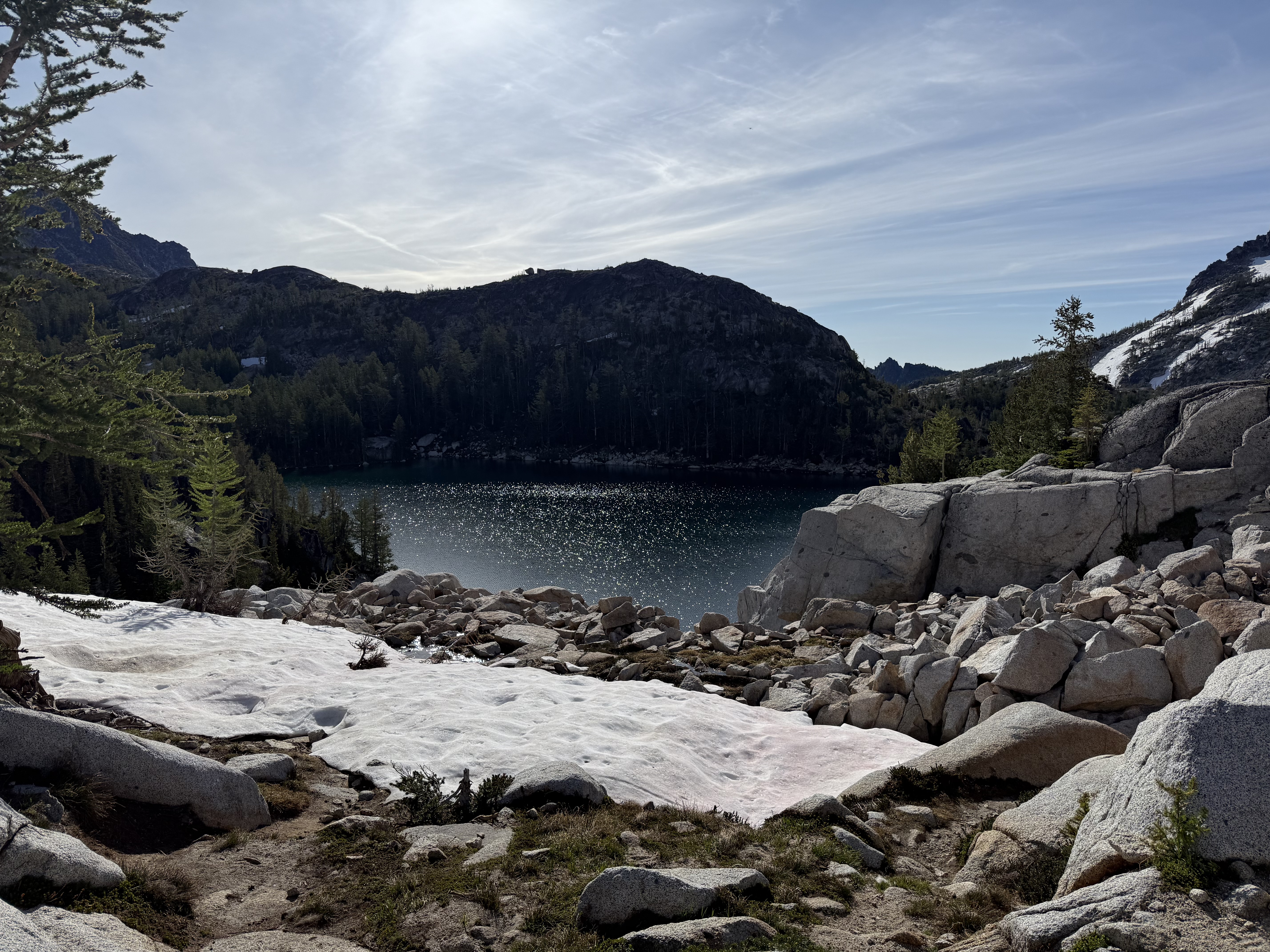 Perfection Lake with jagged snowy peaks viewed from the campsite area