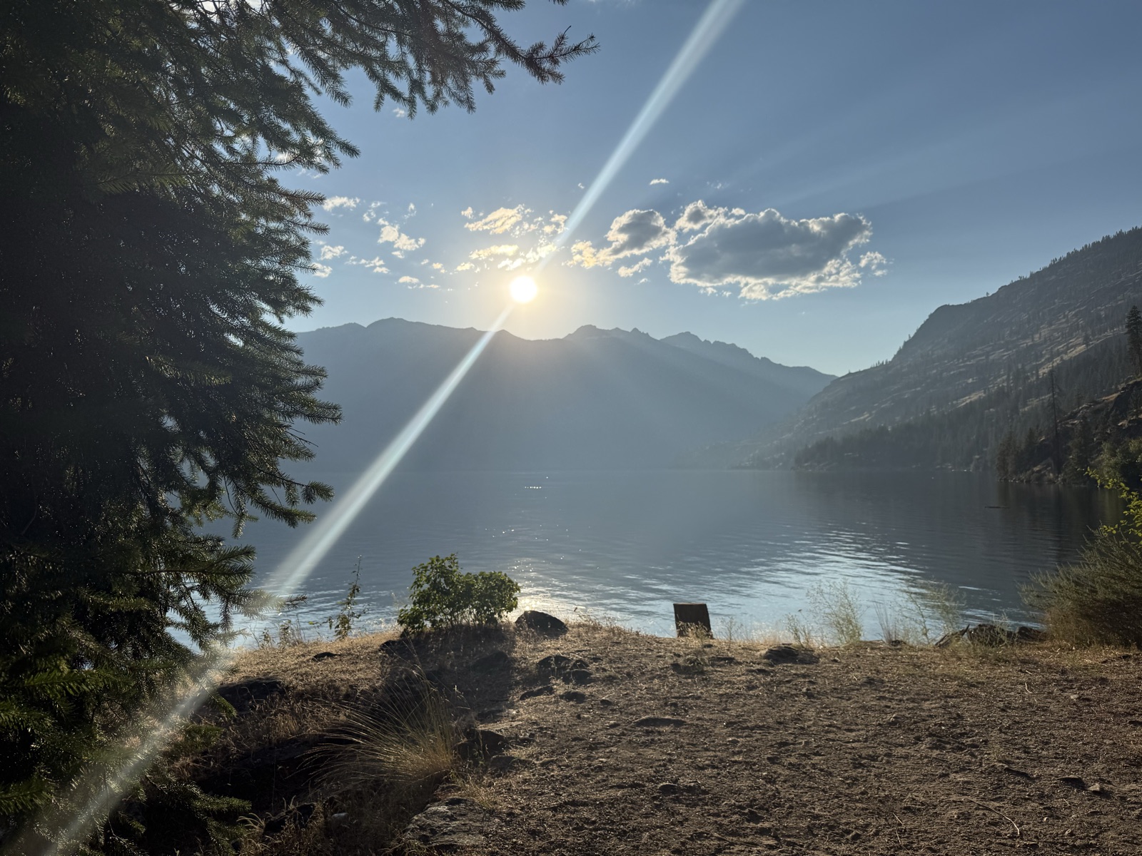 The sun setting over the mountains across Lake Chelan from the campsite at Cascade Creek