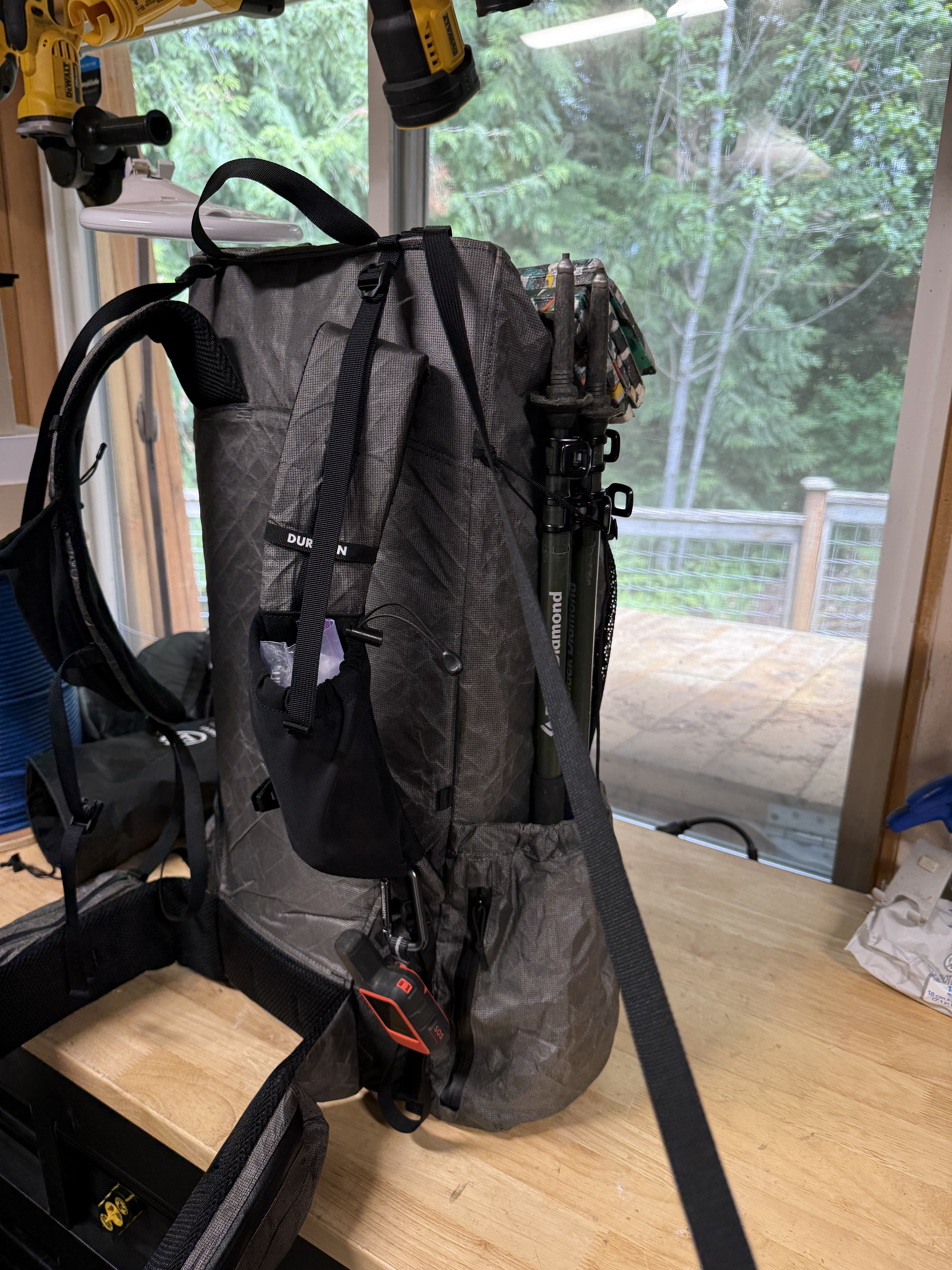 Side profile showing Durston branding, hip belt pocket, and V-strap