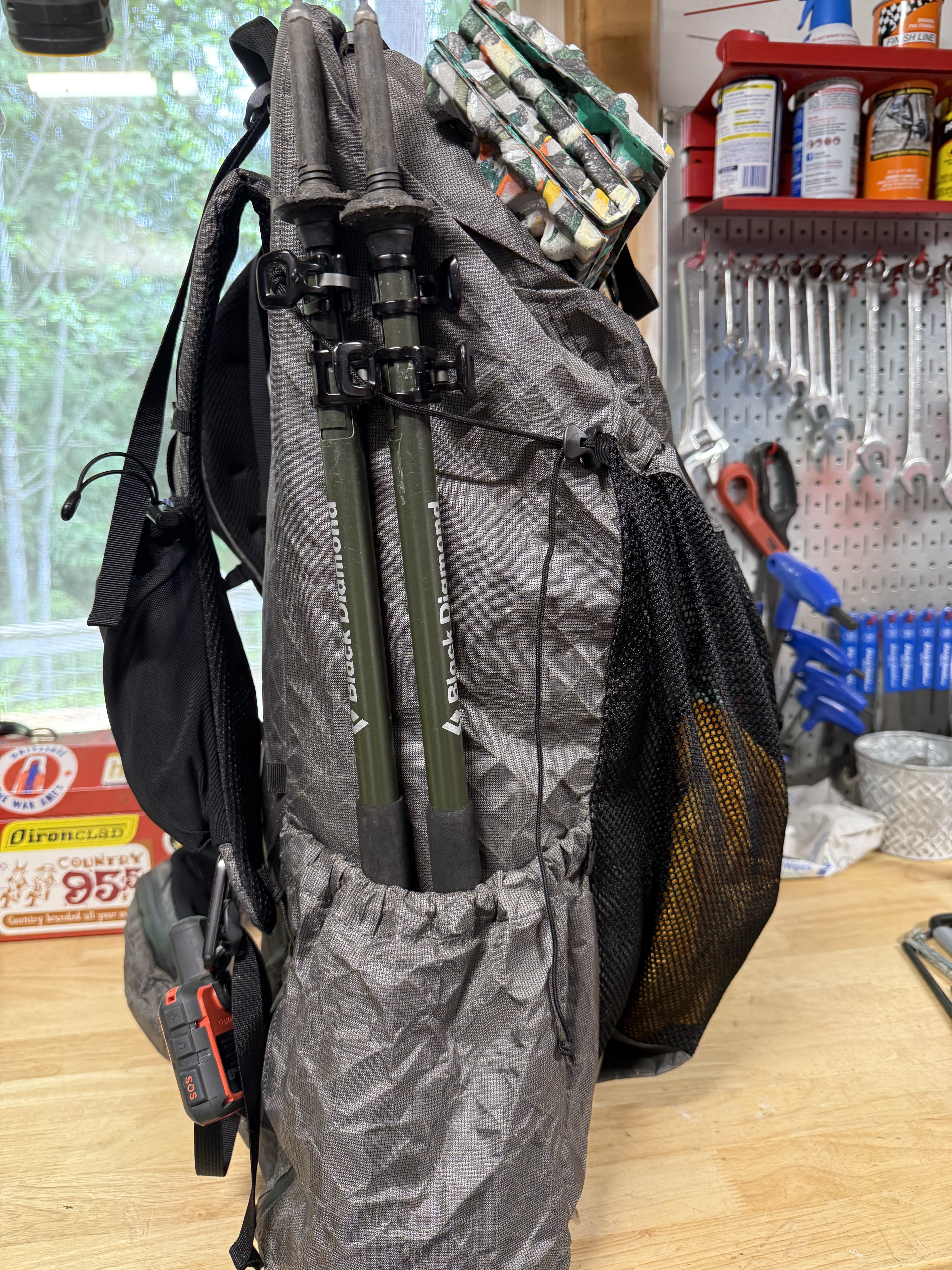 Black Diamond trekking poles secured in the side holster