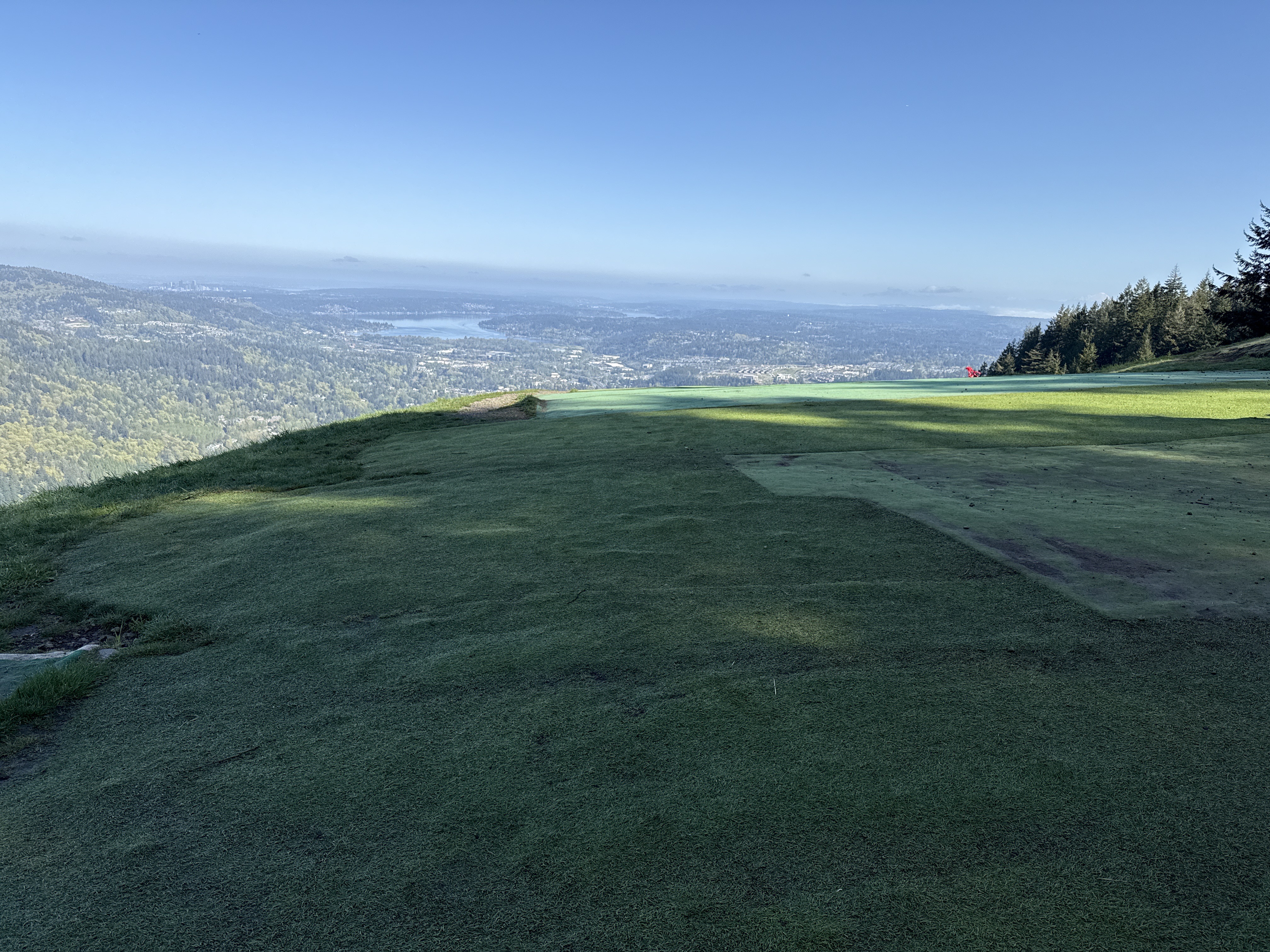 Open paraglider launch meadow at Poo Poo Point with panoramic views